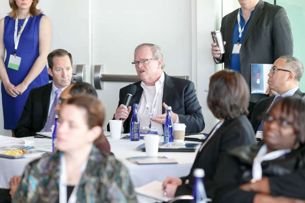 Attendee asking a question after Dave Powner's presentation